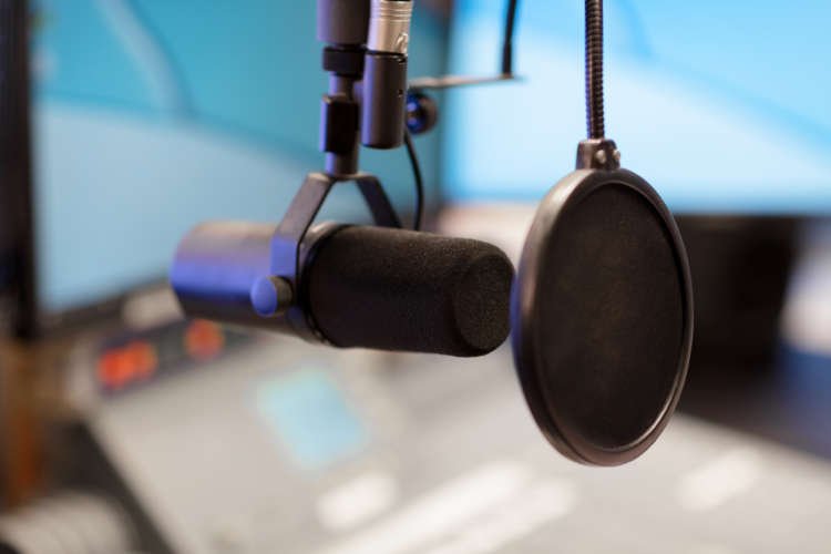 Podcast microphone symbolizing self-improvement discussions - Global Banking & Finance Review