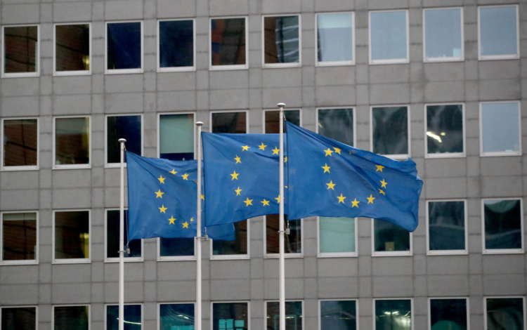 European Union flags flutter outside the European Commission headquarters in Brussels