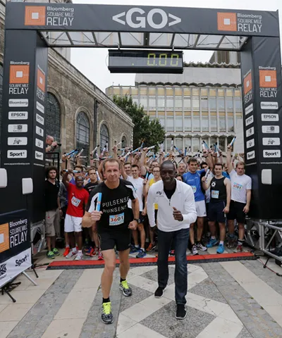 Michael Johnson and Greg Whyte line up at the start of the Bloomberg Squ...