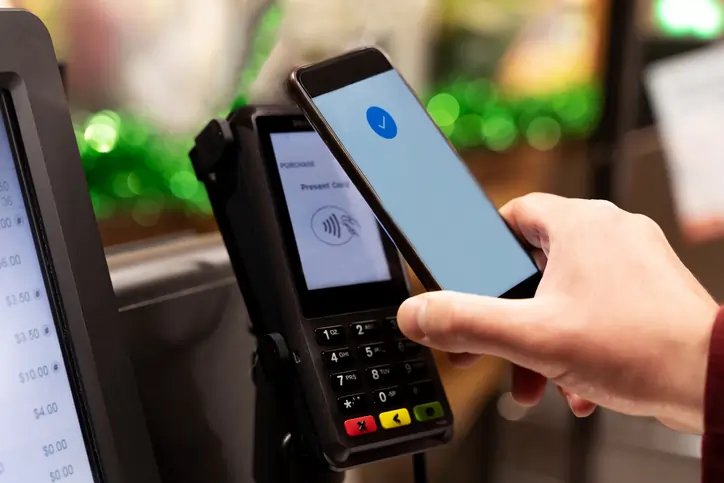 A person using Pay By Bank for a quick payment at checkout - Global Banking & Finance Review