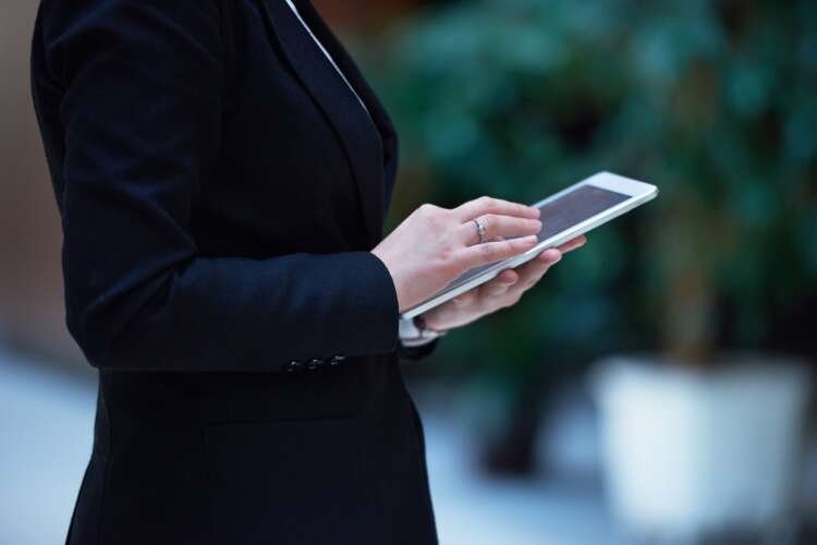 Businesswoman analyzing digital strategy on a tablet - Global Banking & Finance Review
