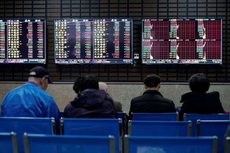 Investors analyzing stock data on screens at a Shanghai brokerage - Global Banking & Finance Review