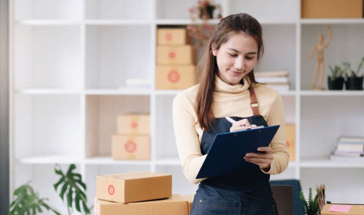 Female SME owners managing online orders, highlighting the importance of SMEs in global finance - Global Banking & Finance Review