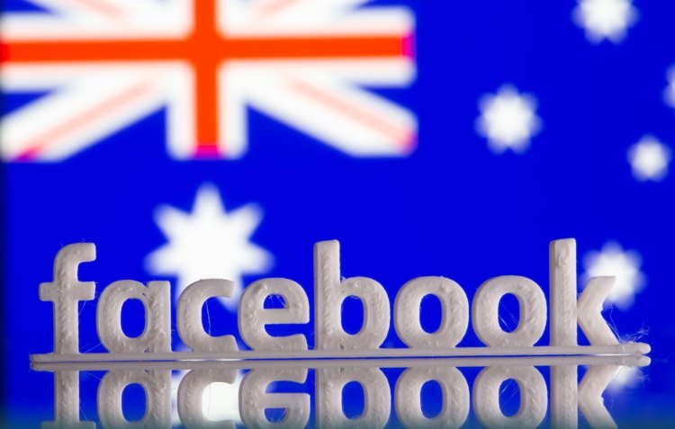 A 3D printed Facebook logo is seen in front of displayed Australia’s flag in this illustration photo