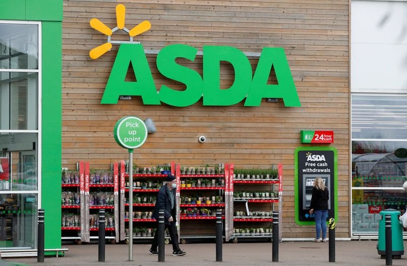 Asda logo and price tags showcasing discounts in a supermarket - Global Banking & Finance Review
