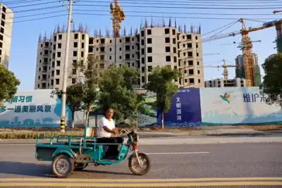 Image for China’s mom-and-pop investors, builders and homebuyers caught in Evergrande debt crisis