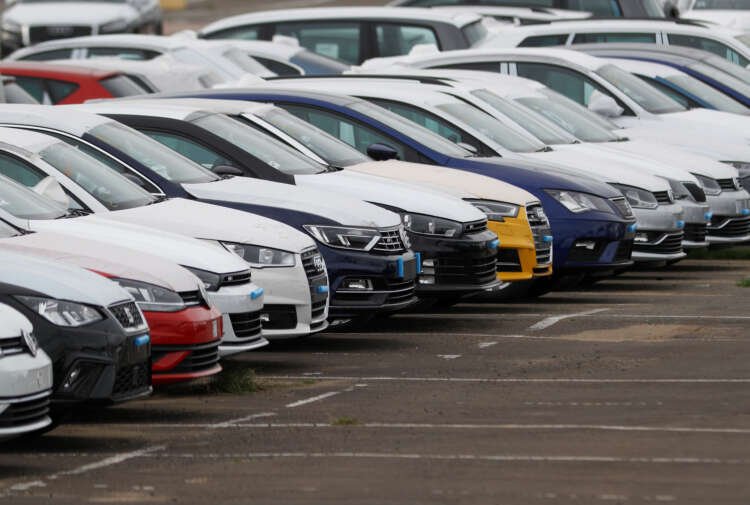 Imported cars parked at Sheerness port, reflecting UK's rising new car sales - Global Banking & Finance Review