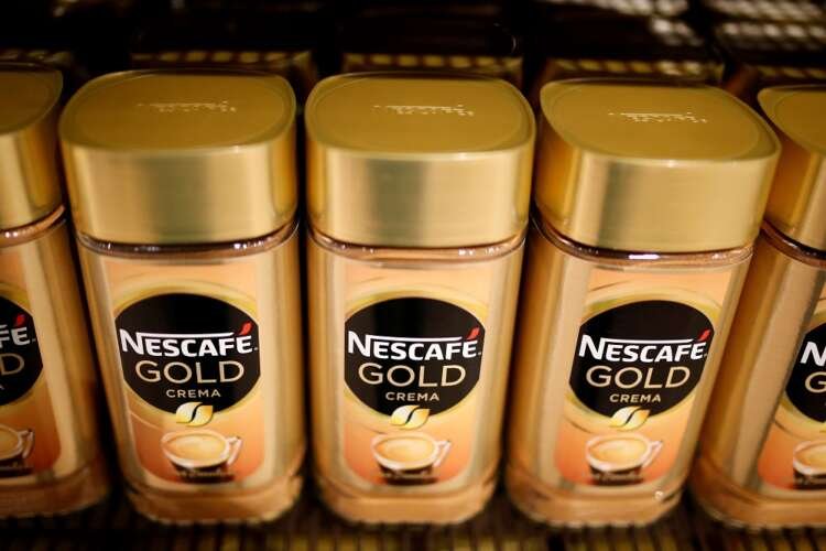 Jars of Nescafe Gold coffee at Nestle headquarters, reflecting the company's sales growth - Global Banking & Finance Review