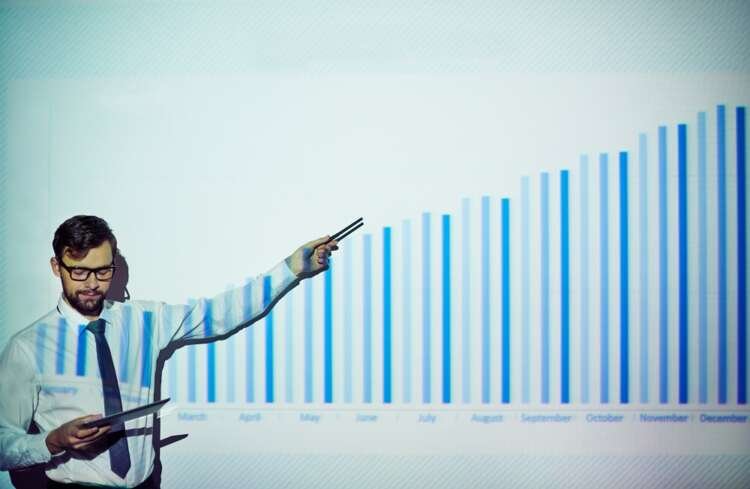 Trading floor scene showcasing hybrid work environment in finance - Global Banking & Finance Review