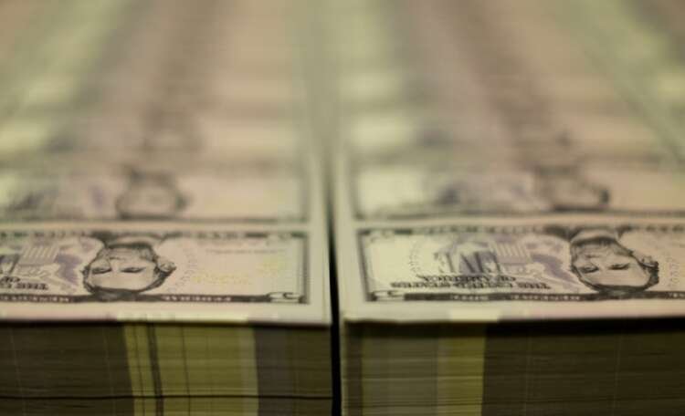 FILE PHOTO: Stacks of Lincoln five dollar bill are seen at the Bureau of Engraving and Printing in Washington