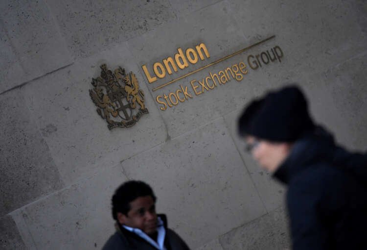 People walking past the London Stock Exchange as FTSE 100 faces decline - Global Banking & Finance Review