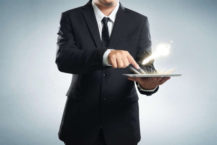 graphicstock-successful-young-businessman-shows-the-screen-of-the-tablet-with-key-to-success-symbo_SO4ZYwowxjx