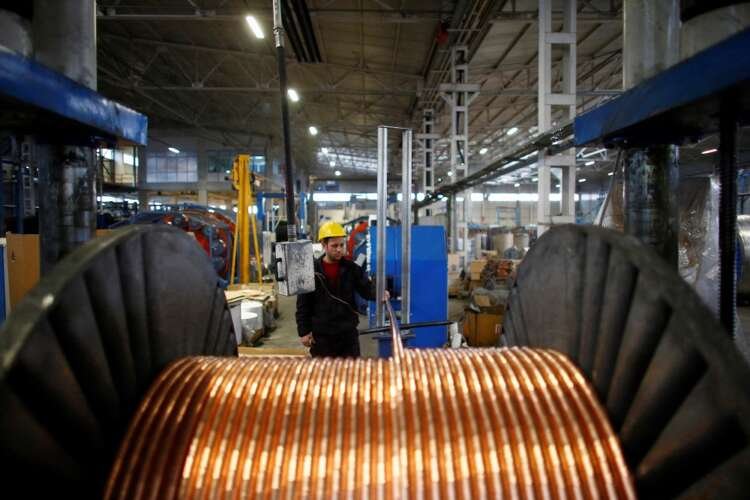 Worker inspects copper cables in a Turkish metal factory - Global Banking & Finance Review