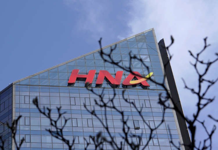 HNA Group logo on building, highlighting the company's financial struggles - Global Banking & Finance Review
