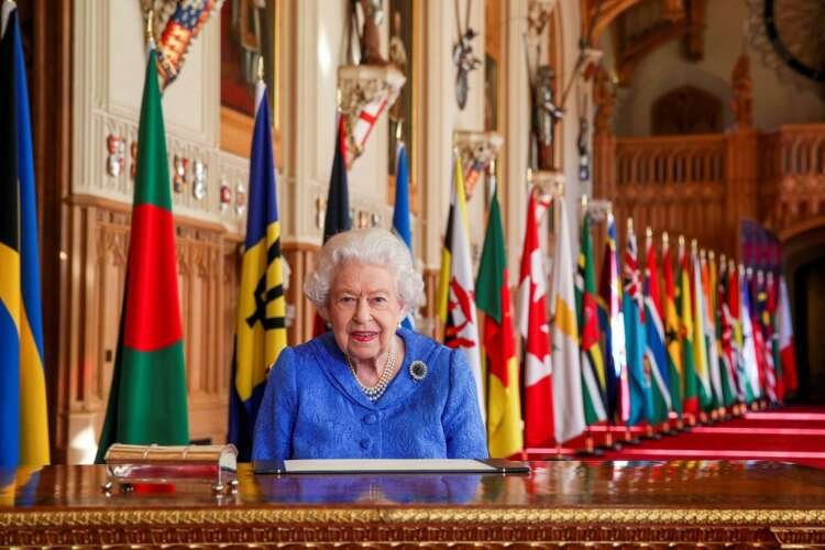 Britain’s Queen Elizabeth II signs her annual Commonwealth Day message at Windsor Castle, Britain