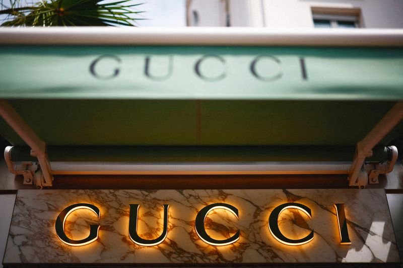 Gucci logo with luxury fashion context reflecting sales slump - Global Banking & Finance Review