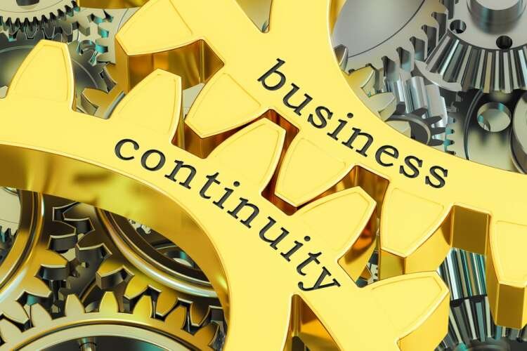 Business continuity concept illustrated with interlocking gearwheels - Global Banking & Finance Review