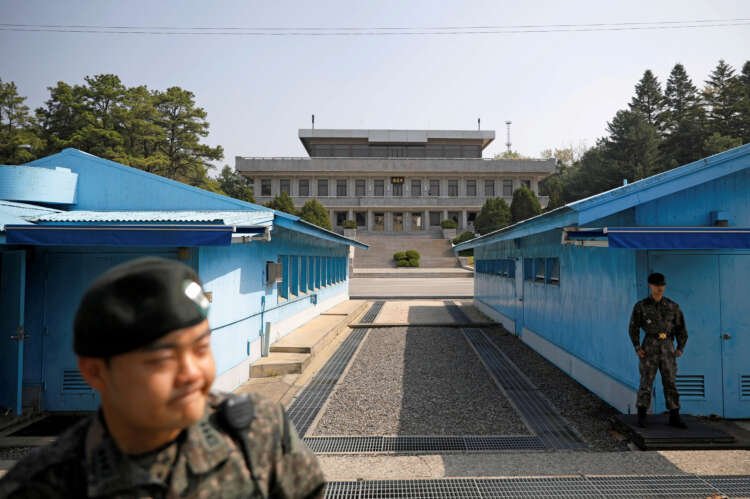 FILE PHOTO: South Korean soldiers stand guard at the truce village of Panmunjom