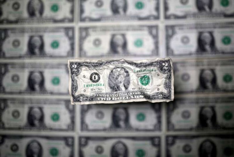 Image for Dollar dips as traders focus on US rate cuts next year