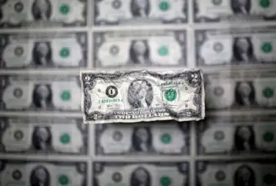 Image for Dollar dips as traders focus on US rate cuts next year