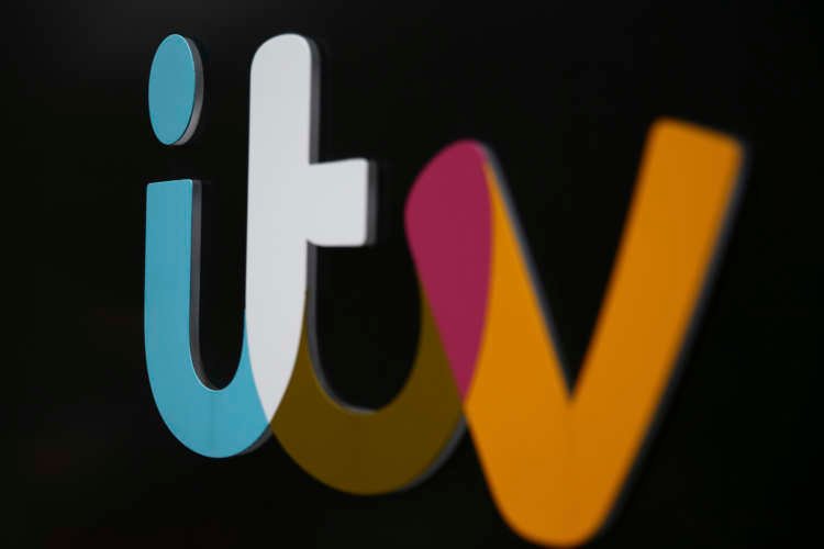 A company sign is displayed outside an ITV studio in London