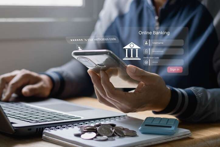 Customer engaging in online banking while ensuring data privacy - Global Banking & Finance Review
