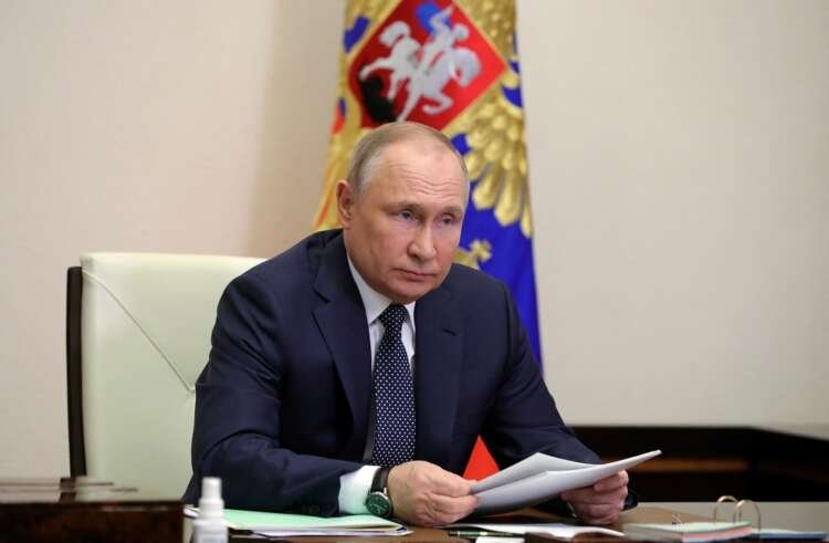 Russian President Vladimir Putin chairs a meeting outside Moscow