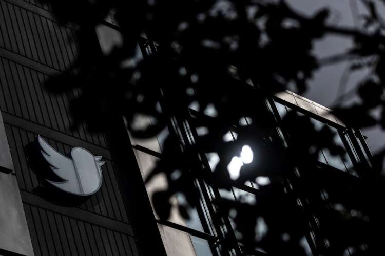 Twitter logo prominently displayed at its San Francisco headquarters, symbolizing the platform's verification changes - Global Banking & Finance Review