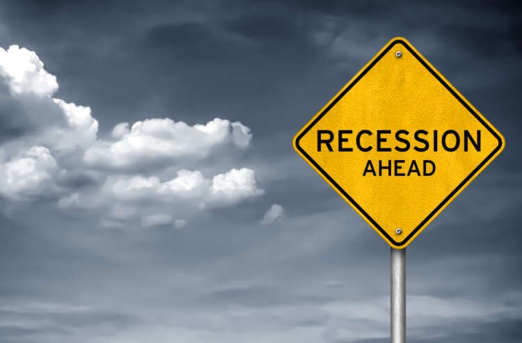 Conceptual image of a road sign indicating recession risks in the economy - Global Banking & Finance Review