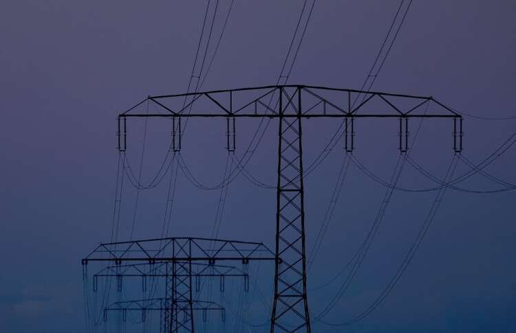 Electrical power pylons symbolizing energy costs in German industry - Global Banking & Finance Review