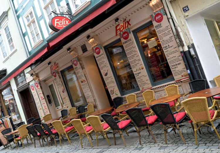View of a restaurant in Marburg, Germany amid Euro zone economic downturn - Global Banking & Finance Review