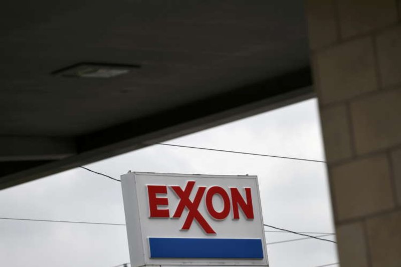 Image for Exxon loses board seats to activist hedge fund in landmark climate vote