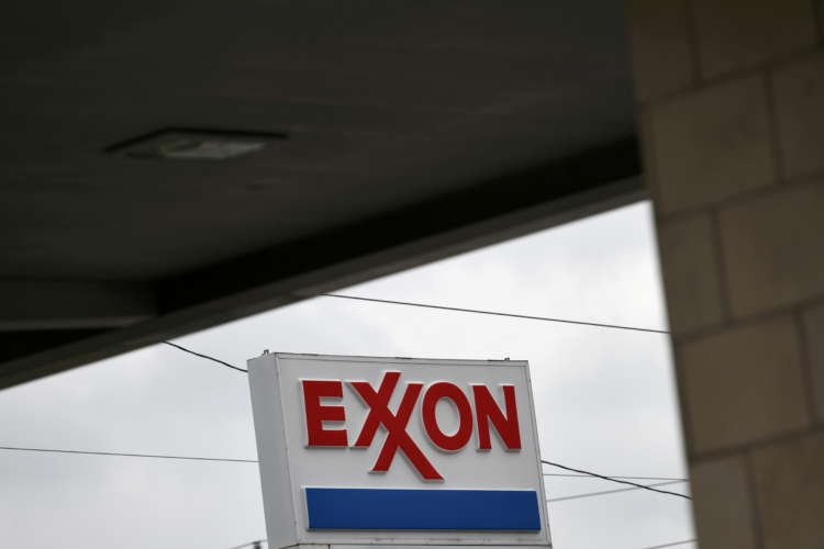 Image for Exxon loses board seats to activist hedge fund in landmark climate vote