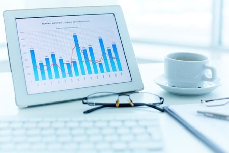 Business professionals analyzing financial data during month end close - Global Banking & Finance Review