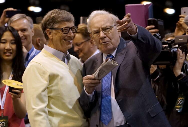 Warren Buffett and Bill Gates discussing philanthropy at a Berkshire Hathaway event - Global Banking & Finance Review