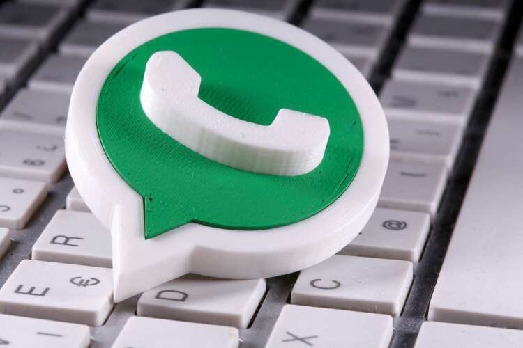 3D-printed WhatsApp logo on a keyboard, symbolizing EU compliance issues - Global Banking & Finance Review