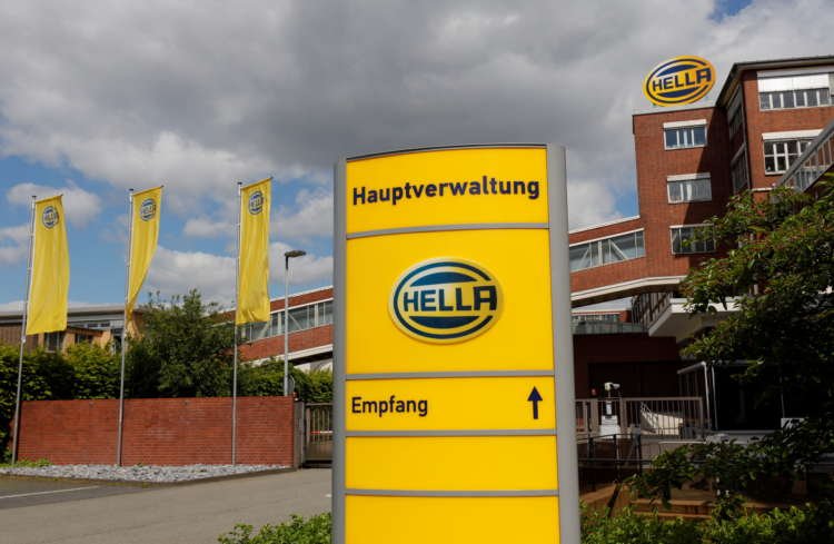 Business meeting discussing Hella's potential stake sale by shareholders - Global Banking & Finance Review