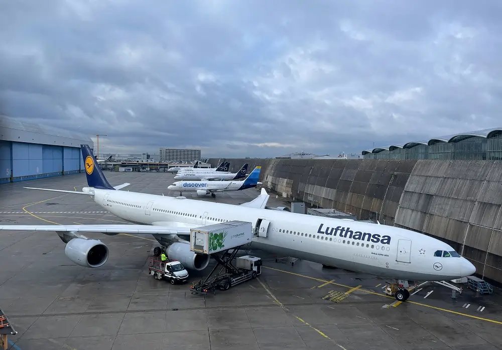 Fraport logo with Frankfurt Airport backdrop highlighting travel recovery issues - Global Banking & Finance Review