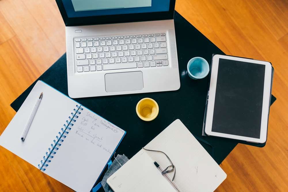 Illustration of research paper writing process with notes and books - Global Banking & Finance Review