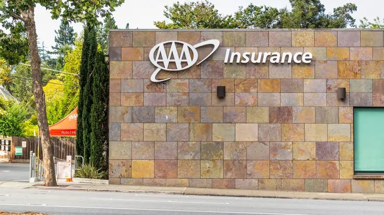 A scenic California road with a car, representing car insurance options in California - Global Banking & Finance Review