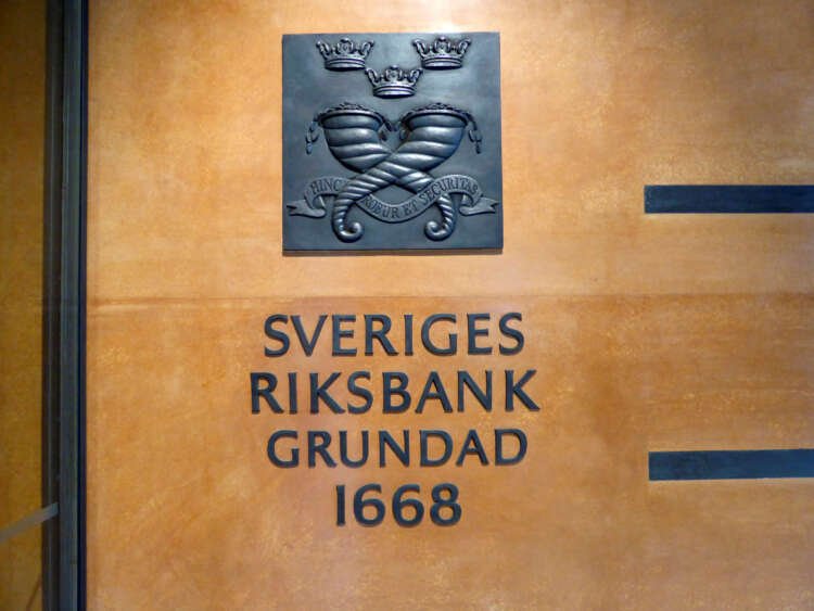 Sweden's central bank sign in Stockholm highlighting fiscal policy and wages - Global Banking & Finance Review