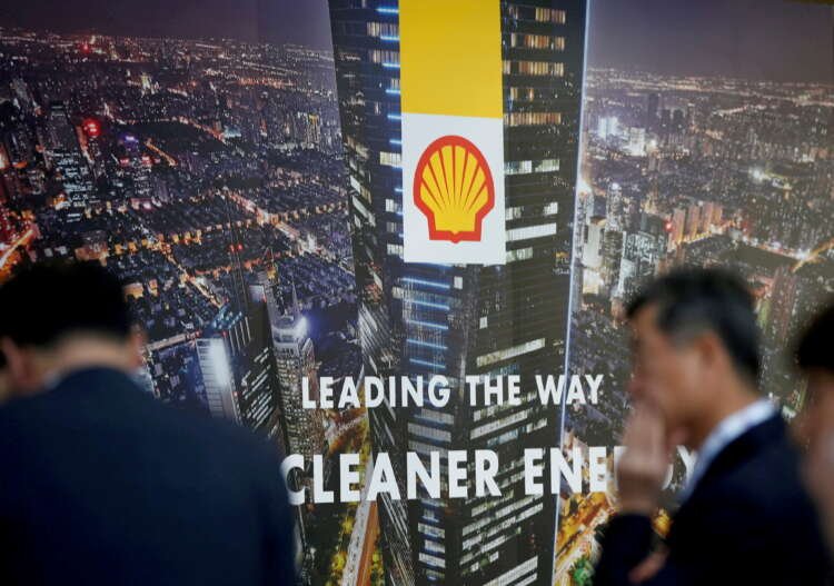 Shell's logo with financial graphs depicting profit increase and dividend boost - Global Banking & Finance Review