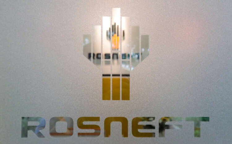 Rosneft logo displayed in an office, related to Udo Giegerich's appointment - Global Banking & Finance Review