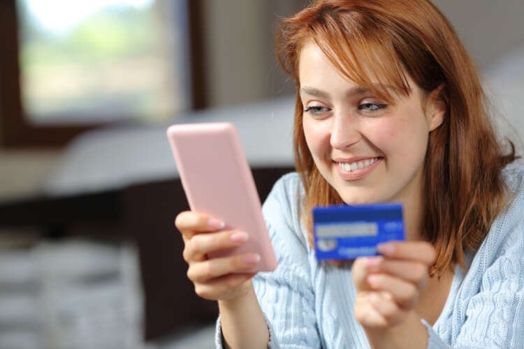 Woman engaging in online payment process using Request to Pay service - Global Banking & Finance Review