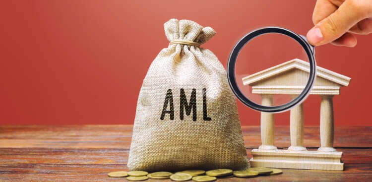 Image depicting money bag and bank building, symbolizing AML challenges - Global Banking & Finance Review