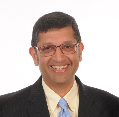 Portrait of Dhiru Tanna discussing cash management strategies in finance - Global Banking & Finance Review