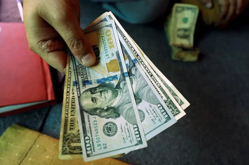 Image for Dollar slips ahead of data, set for first monthly drop in 2024