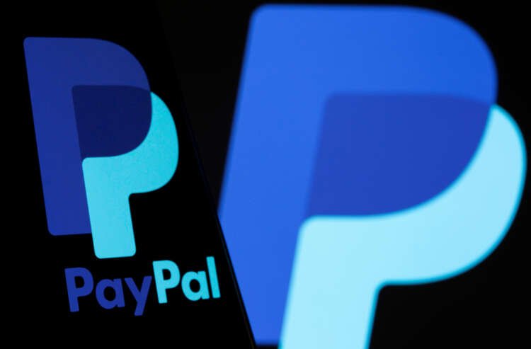 PayPal logo on smartphone illustrating the company's spending warning - Global Banking & Finance Review