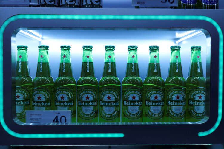 Heineken beer bottles on display, symbolizing European resilience amid Asia slowdown - Global Banking & Finance Review