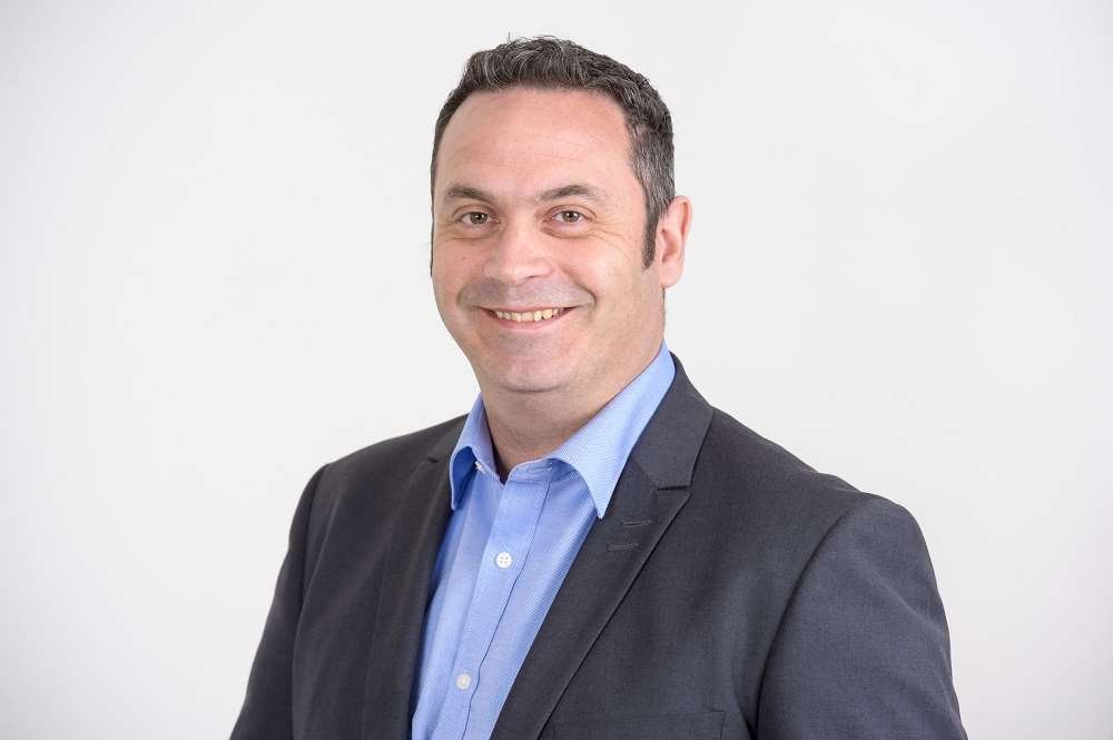 Business professional discussing banking disruption strategies - Global Banking & Finance Review